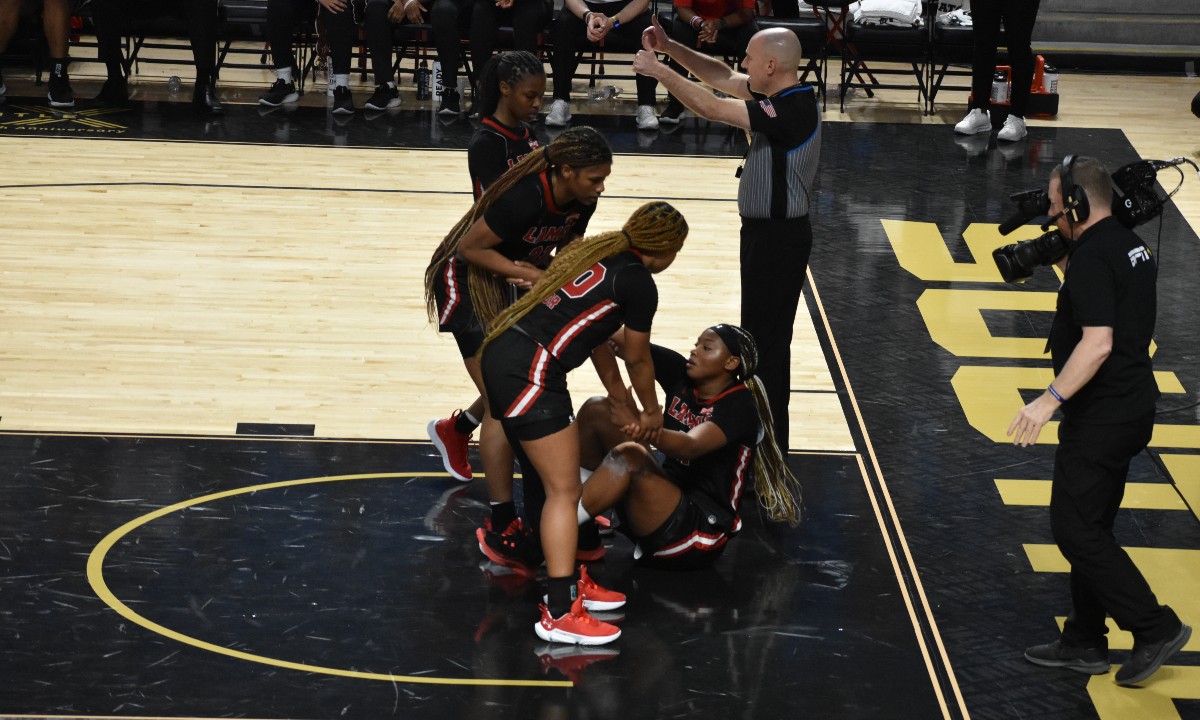Akasha Davis is helped up by her teammates during the Southland Conference championship game, March 8, in Lake Charles, Louisiana. Photo credit: Keagan Smith, UP sports editor.