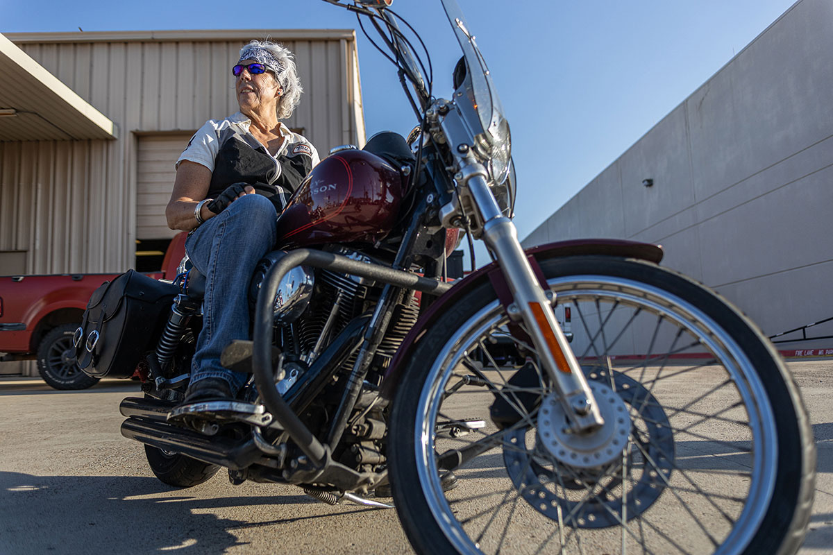 A lady biker sits on her motorcycle as she waits to drive off at the Ladies in Leather parade & rally, in Teddy Morse's Cowboy Harley-Davidson in Beaumont, Texas, Sep. 7. UP photo by Brian Quijada.