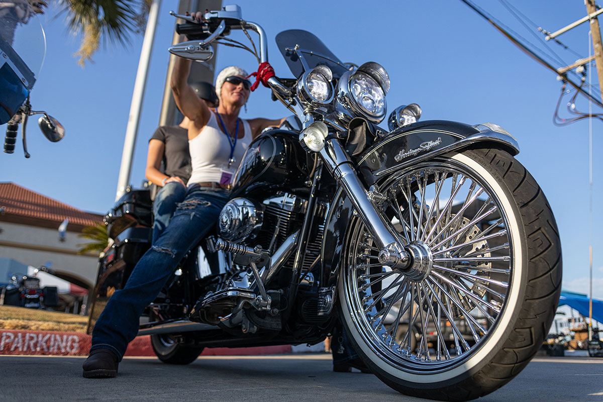 A biker and her partner get ready to drive off at the Ladies in Leather parade & rally, in Teddy Morse's Cowboy Harley-Davidson in Beaumont, Texas, Sep. 7. UP photo by Brian Quijada. 