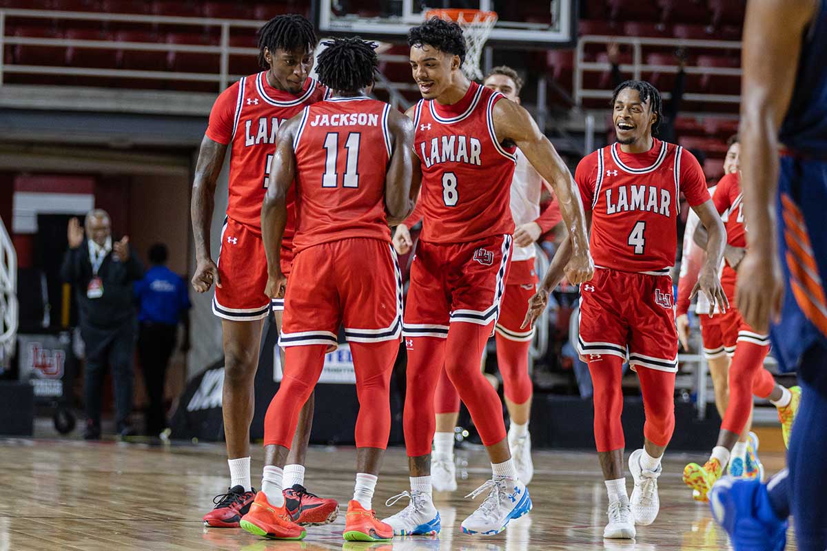 LU guard Ja’Sean Jackson celebrates with teammates after hitting a buzzer beating three to end the first half against the University of Texas at San Antonio, Nov. 14, at the Montagne Center. UP image by Brian Quijada.