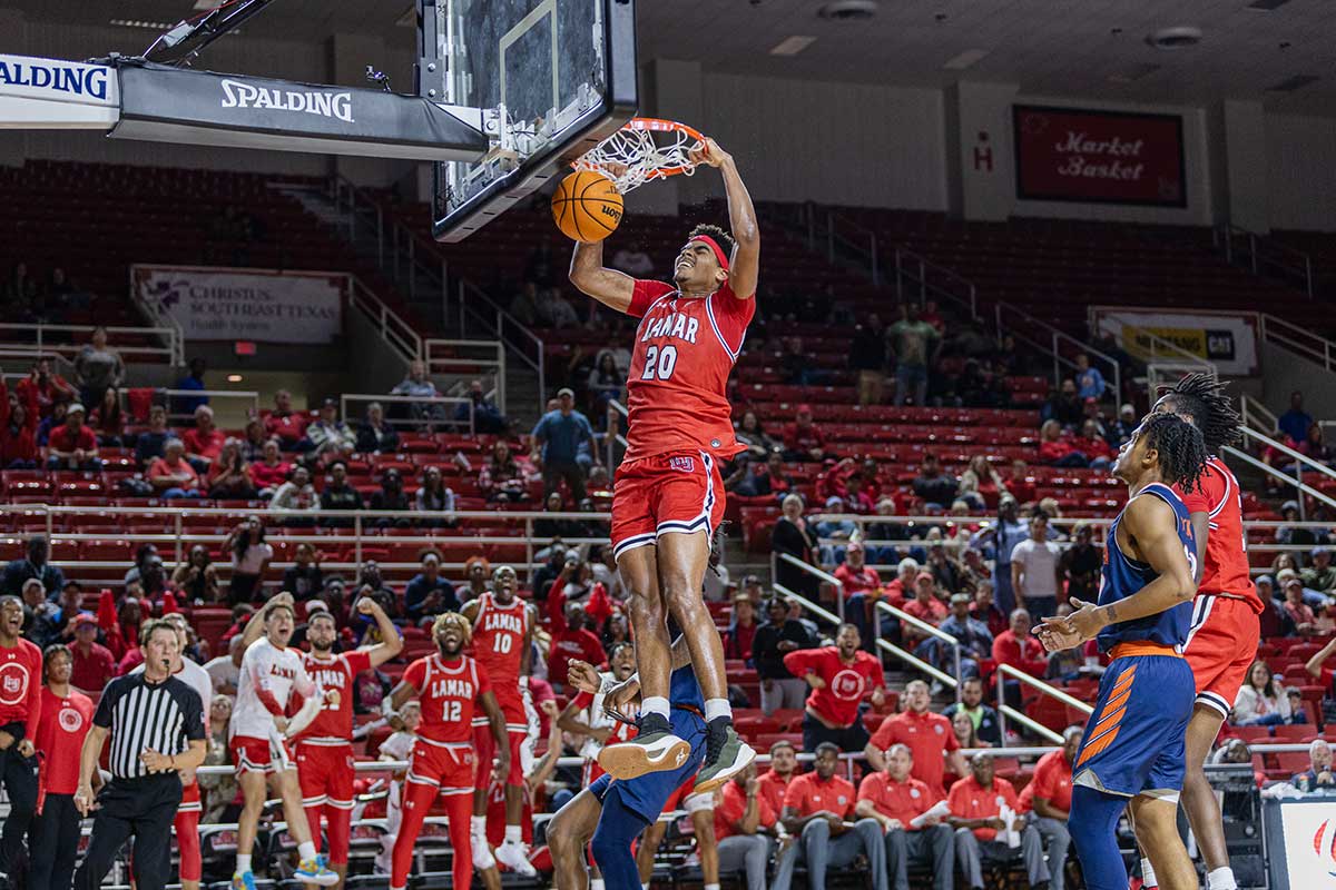 Lamar center Adam Hamilton dunks the ball against the University of Texas at San Antonio, Nov. 14, at the Montagne Center. Hamilton finished the game with 16 points and 14 rebounds. UP image by Brian Quijada.