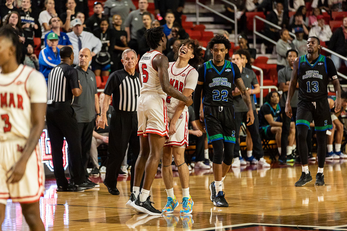 Freshman guard Nate Calmese celebrates with teammate Terry Anderson after winning possession of the ball in the last moments of the game, Jan 19, at the Montagne Center. UP image by Brian Quijada.