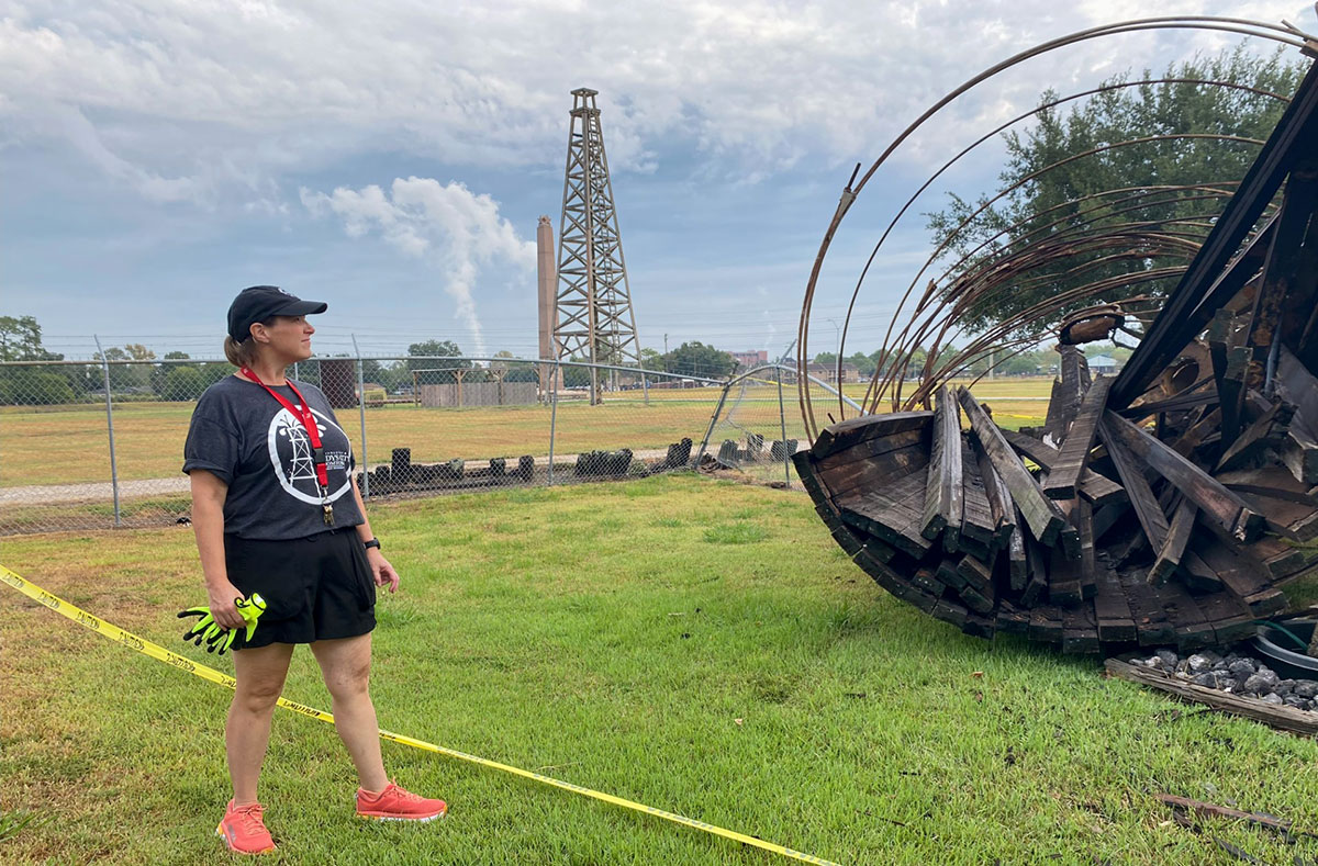 Museum director, Rayanna Hoeft, gazes at the destoryed oil tank. UP photo by Maddie Sims.