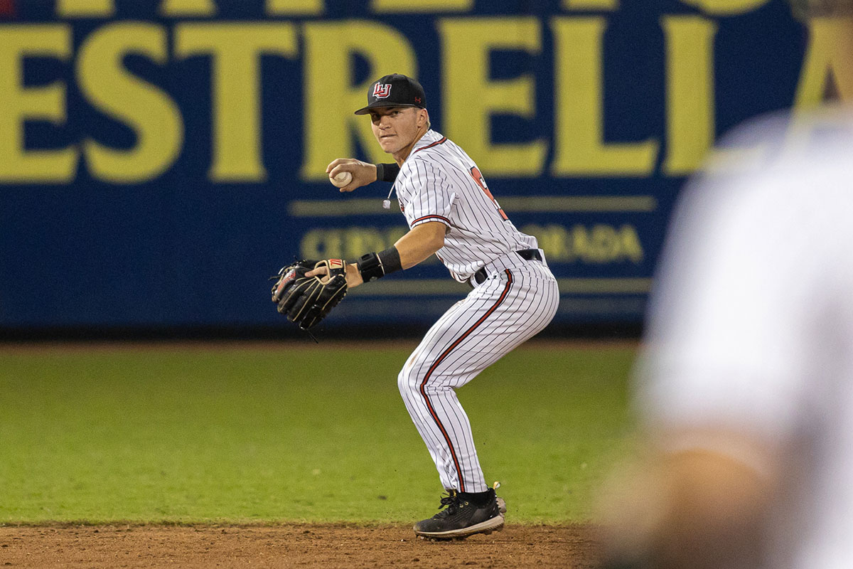 Lamar shortstop Kanin Dodge throws the ball to first base to get the out against Stephen F. Austin State University in the Sugarland Classic on Feb. 25, at the Constellation Field in Sugarland, TX. UP photo by Brian Quijada.