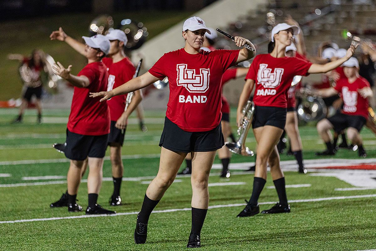 Members of Lamar University’s marching band, the Showcase of Southeast Texas, wearing their summer uniforms because of the blistering heat, perform at half time of LU’s opening football game, Aug. 31, at Provost Umphrey Stadium. UP photo by Brian Quijada.