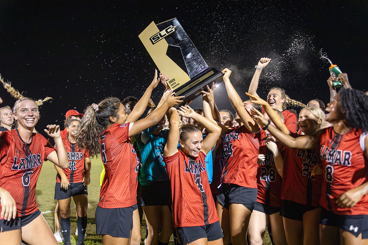 The Lady Cards raise the Southland Conference regular season trophy for the second consecutive year. UP photo by Brian Quijada.
