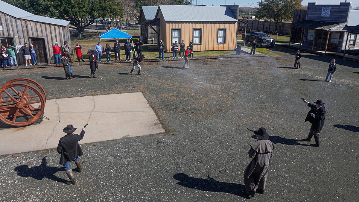 Boom town reenactors shoot at each other as part of a reenactment during the 123rd Spindletop Anniversary at the Spindletop Gladys-City Boomtown Museum, Jan. 13. UP photo by Carlos Viloria.