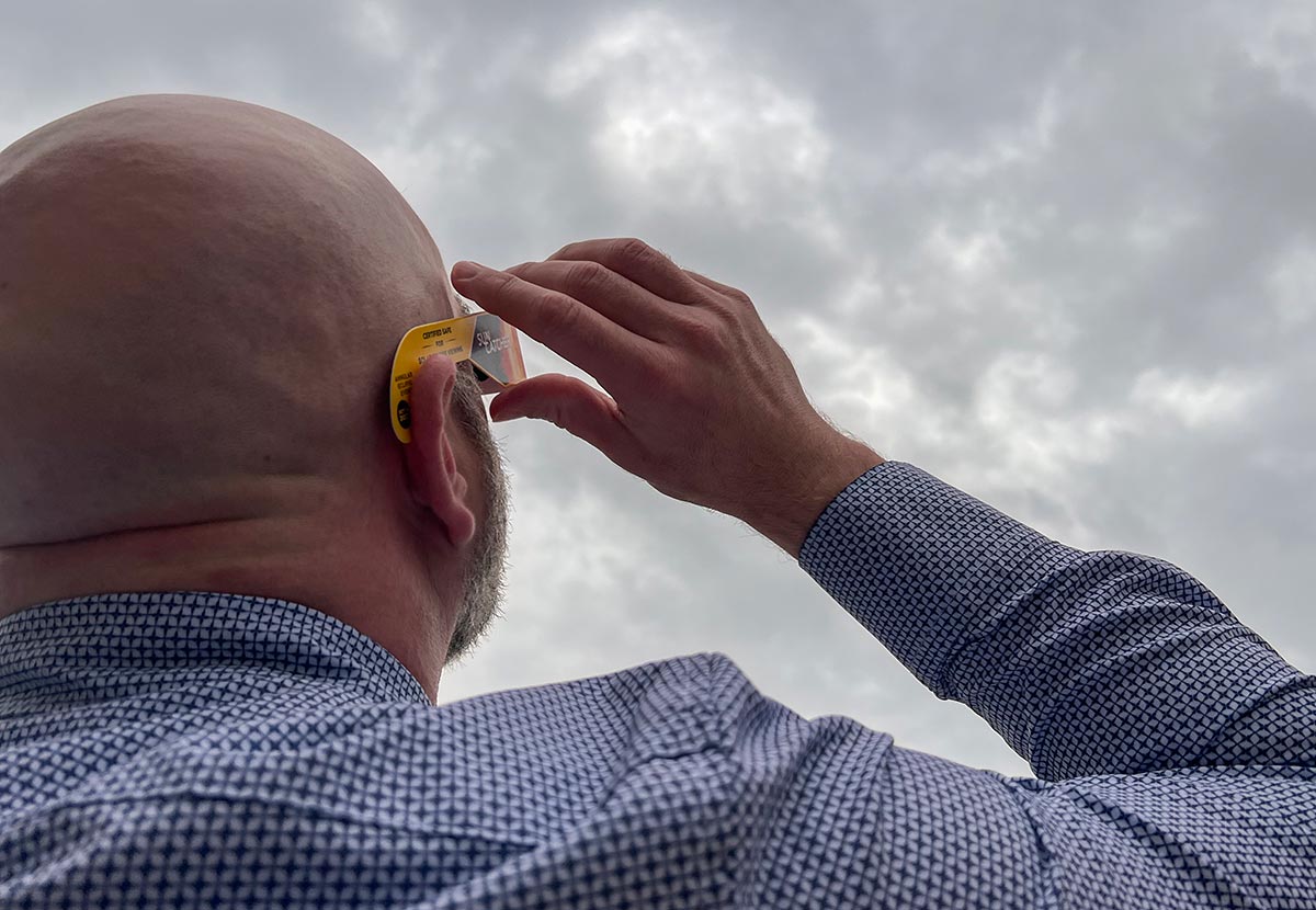 Golden Wright looks up to witness the solar eclipse, at Lamar University, April 8. UP photo by Taylor Justice.