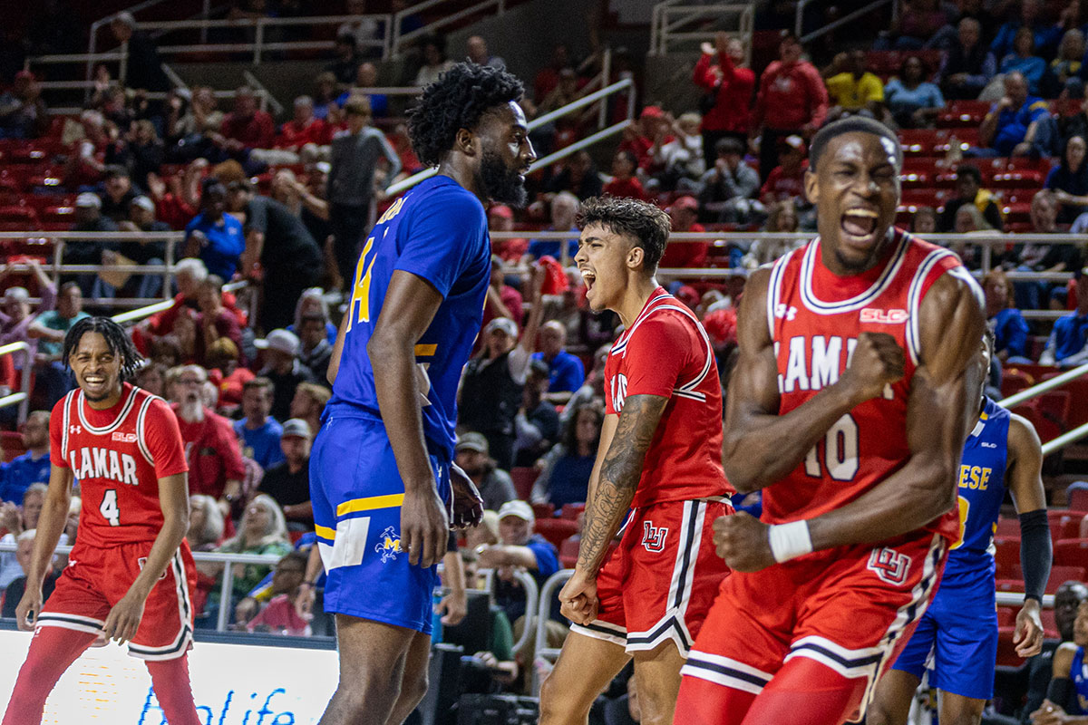 The Lamar men’s basketball team celebrates after Errol White dunks the basket against McNeese University, in the Neches Arena at the Montagne Center, Feb. 26. UP photo by Brian Quijada