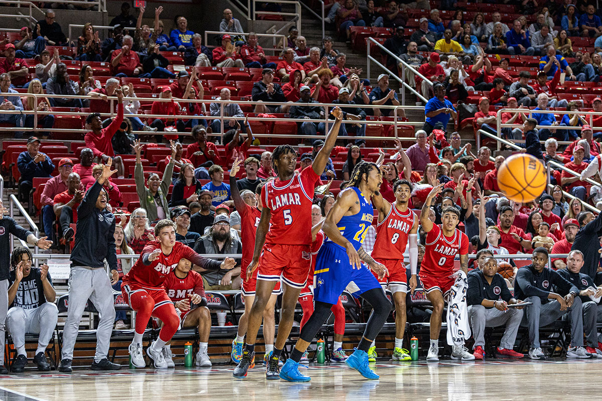 LU forward Terry Anderson hits a three pointer as the crowd celebrates  in the Neches Arena at the Montagne Center, Feb. 26. UP photo by Brian Quijada