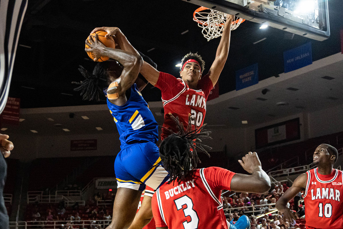 Lamar forward Adam Hamilton blocks a shot against McNeese University, in the Neches Arena at the Montagne Center, Feb. 26. UP photo by Carlos Viloria.