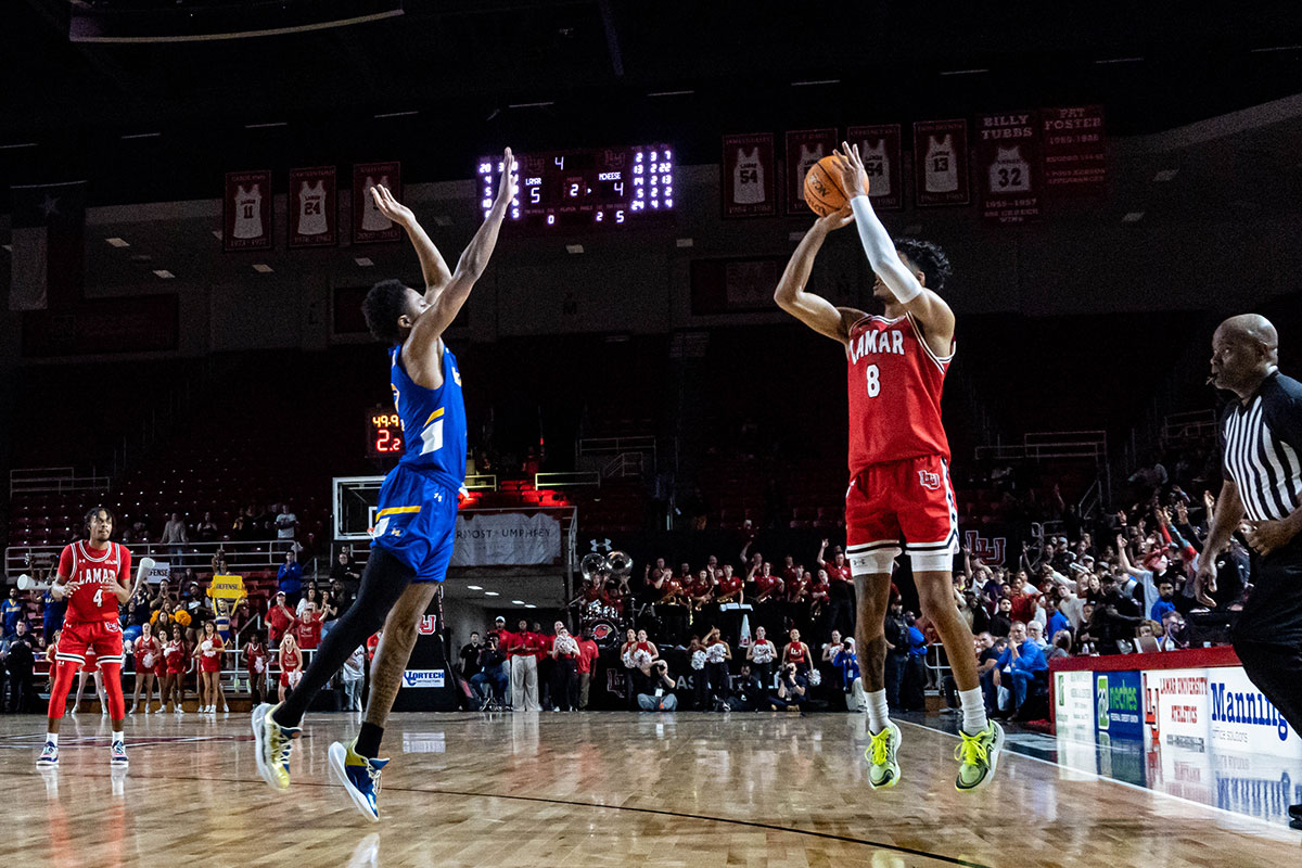 Cardinal guard B.B. Knight hits a three pointer against McNeese University, in the Neches Arena at the Montagne Center, Feb. 26. UP photo by Carlos Viloria.