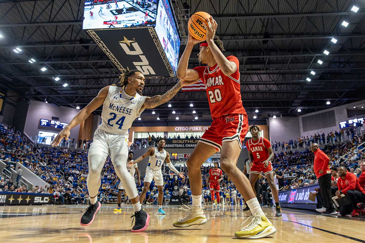 Lamar center Adam Hamilton posts up against McNeese defender during the Southland Conference tournament semifinal, in The Legacy Center, Lake Charles, La. March 12. UP photo by Brian Quijada.