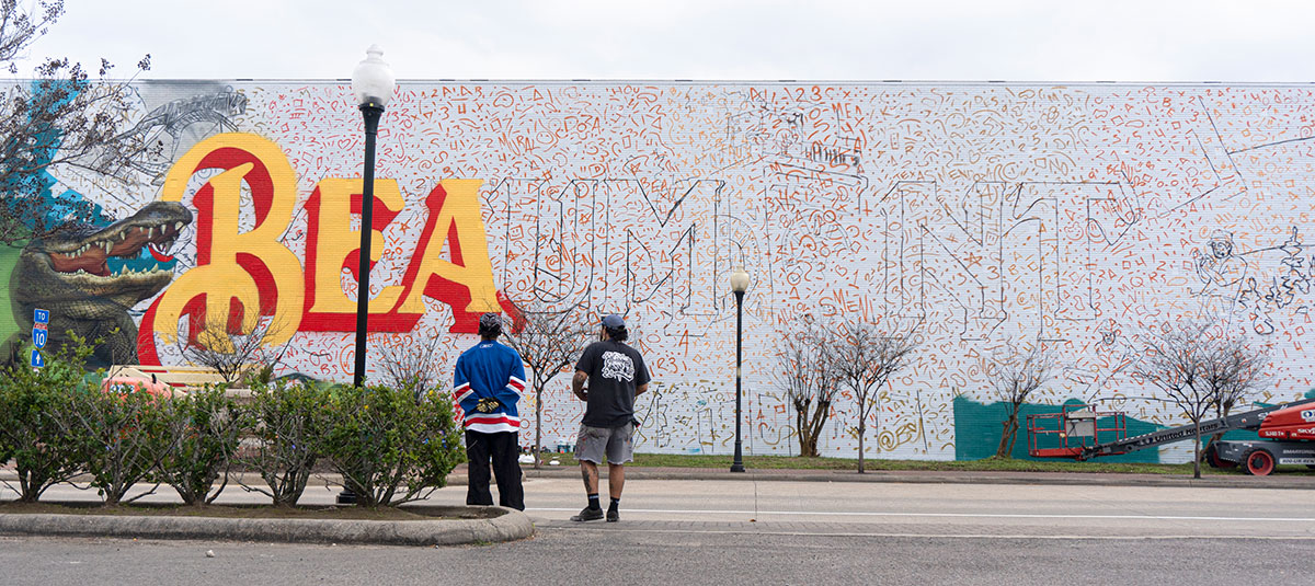 Floyd Mendoza III looks back at his mural during Mural Fest 2024, in downtown Beaumont, Mar. 2. UP photo by Carlos Viloria.