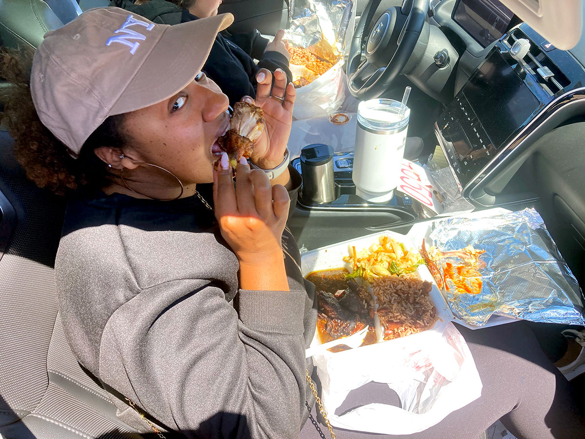 A customer eats a meal from Mrs. V’s Kitchen in her car. UP photo by Josiah Boyd. 