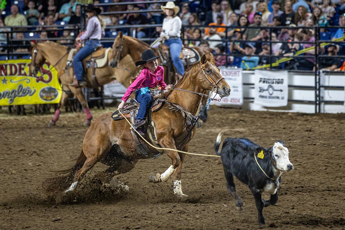 A girl ropes a calf during the South Texas State Fair Rodeo, Beaumont, Texas, March 23. UP photo by Brian Quijada.