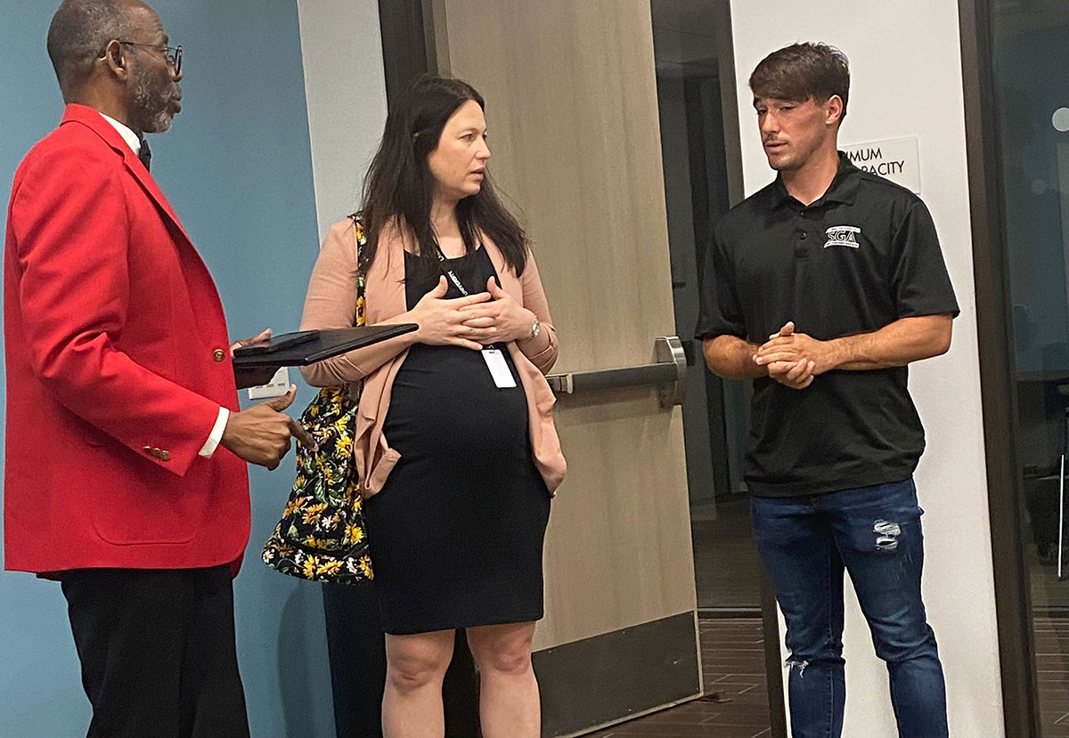 LU vice president of strategic initiatives & community relations Freddie Titus, left, Emily Ardolino, and SGA president Jonah Smith chat before the Student Government meeting, Feb. 20. UP photo by Maddie Sims.