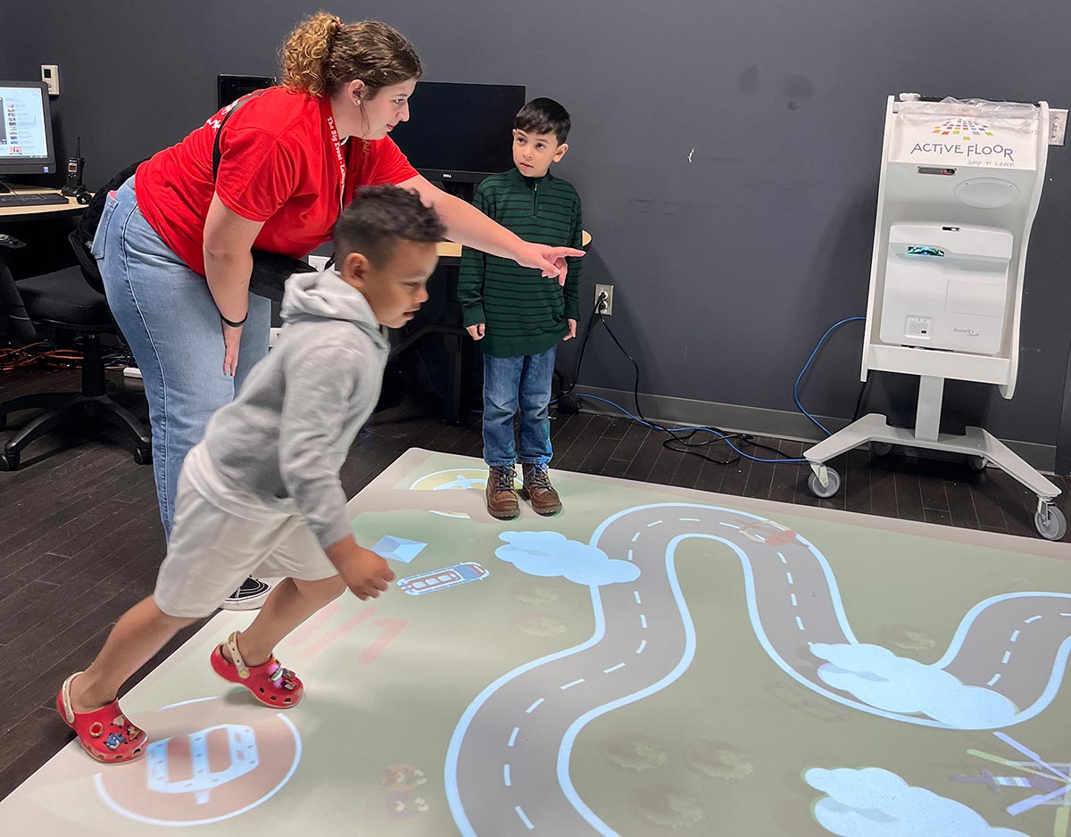 An LU student, above left, oversees a play activity at Sam Houston Elementary, March 23. UP photo by Clarissa Hernandez.