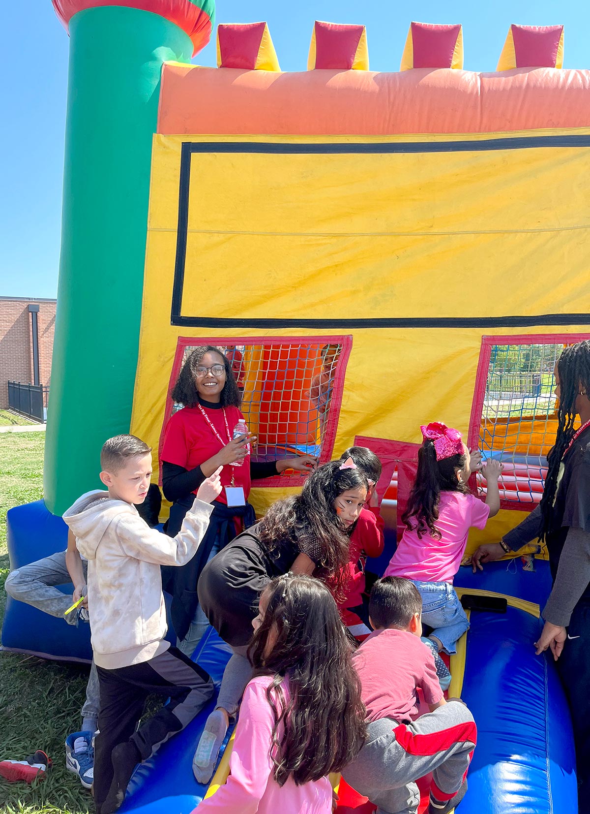 An LU student, top left, oversees the bounce house. UP photo by Clarissa Hernandez.