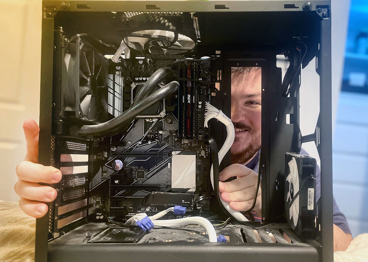 Lumberton junior Brennan Lawrence taking apart a computer. UP photo by Gage Gilliam.