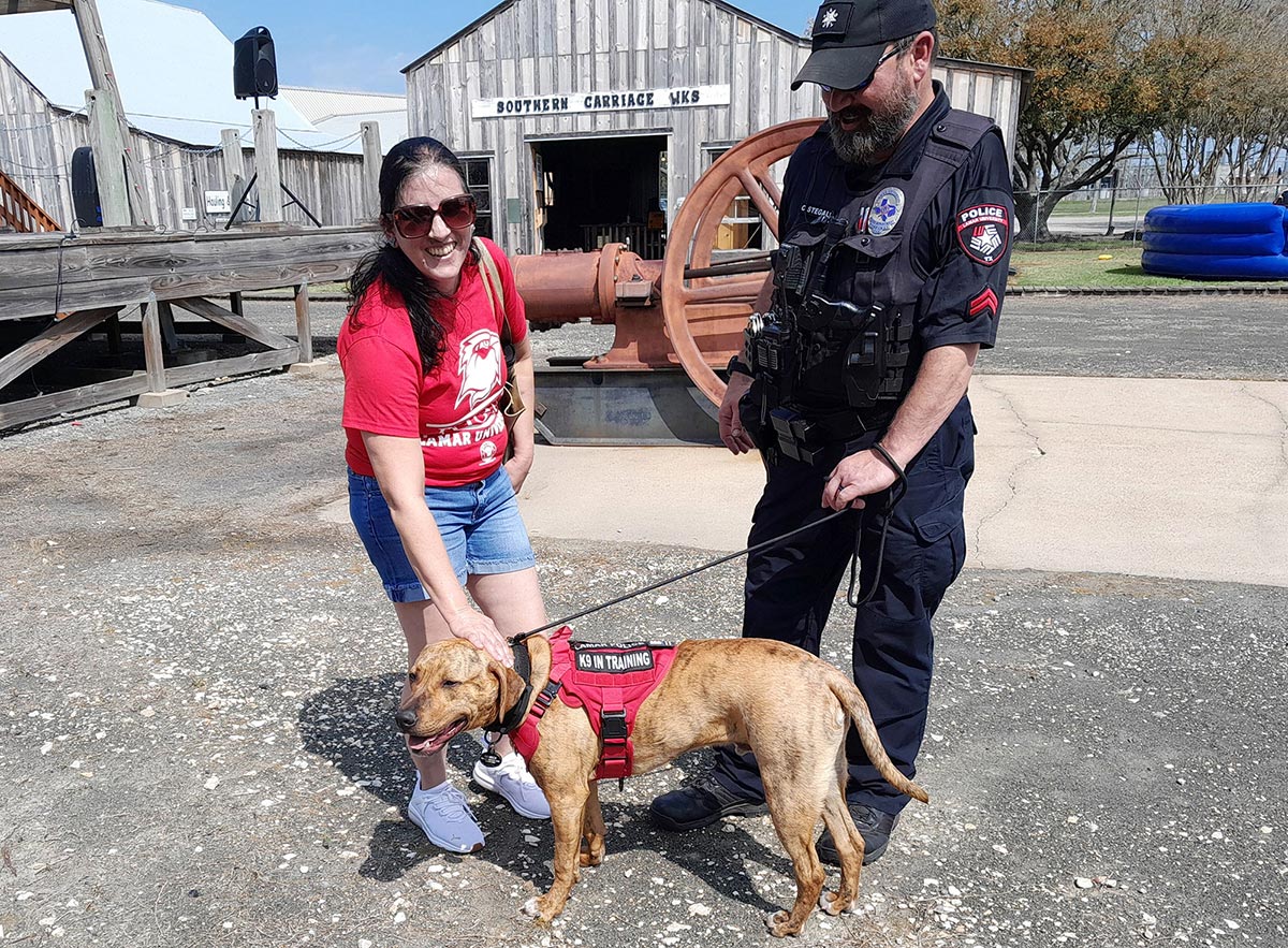 LUPD’s new victim assistance K9 unit, Derrick Boomer Lamar, above with his handler Chad Stegall, LUPD corporal, was unveiled Jan. 14 at Spindletop Gladys City/Boomtown Museum. UP photo by Daniela Contreras.