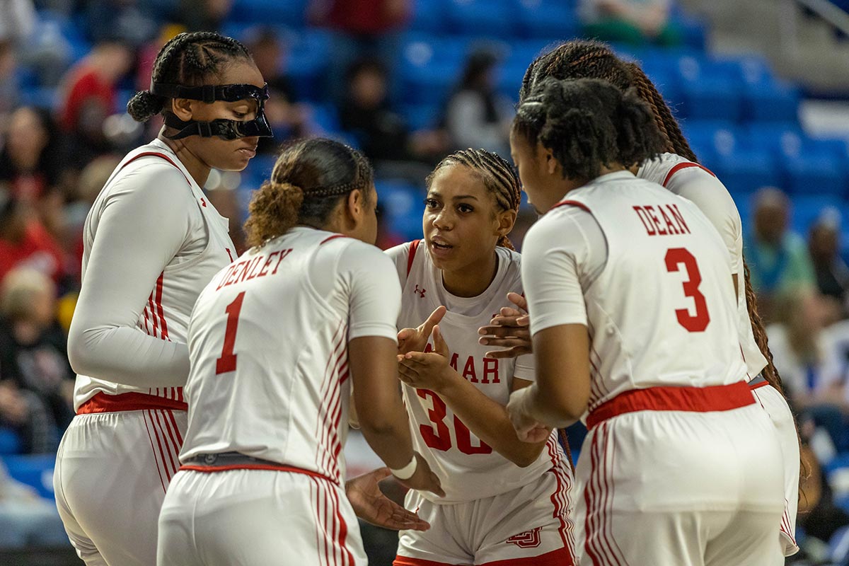 The Lady Cards huddle up to set up a play against TAMUCC during the Southland Conference tournament final, in The Legacy Center, Lake Charles, La. March 14. UP photo by Brian Quijada.