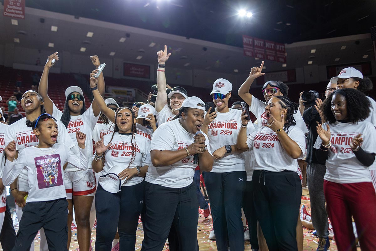 Head coach Aqua Franklin gives a small speech to the fans during the Southland Conference regular season trophy presentation, in the Neches Arena at the Montagne Center, Mar. 7. UP photo by Brian Quijada.