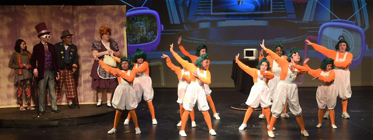 The Oompa Loomba ensemble performs in "Roald Dahl's Charlie and The Chocolate Factory" through May 25. Courtesy photo.