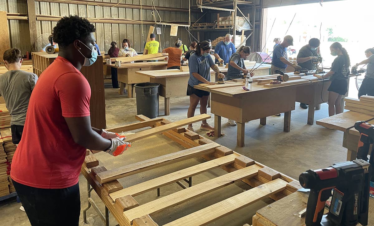 Group builds beds for children